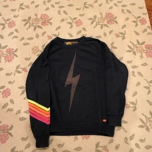 Aviator Nation Black Sweater with Lightning Bolt and Rainbow Sleeve